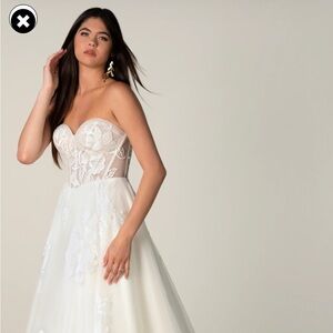 Stella York new with tags, never worn. Size 12. Chic Strapless Ivory Gown